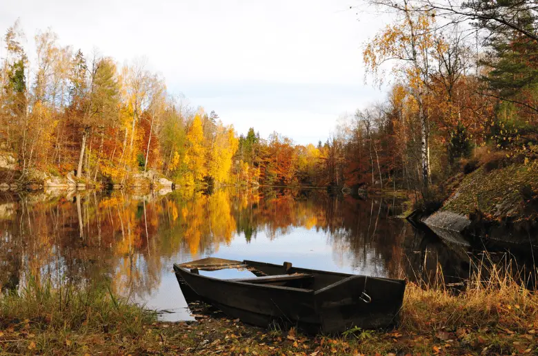 Picture of an old fishing boat by a river