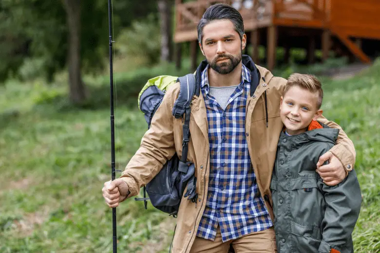 Picture of a Father and son with fishing rod and backpack