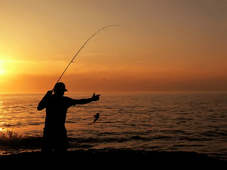 Fisherman Fishing At Dusk