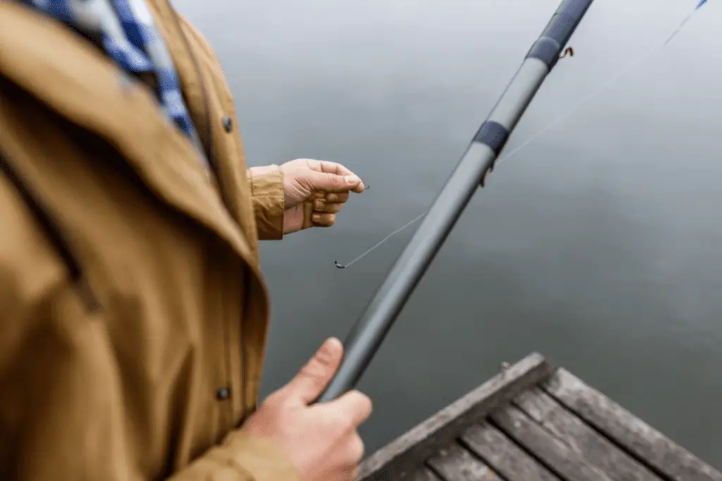 Man with fishing rod and hook