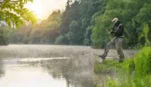 Man fishing by a river