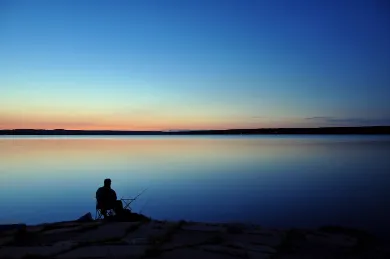 Man fishing with a spinning reel