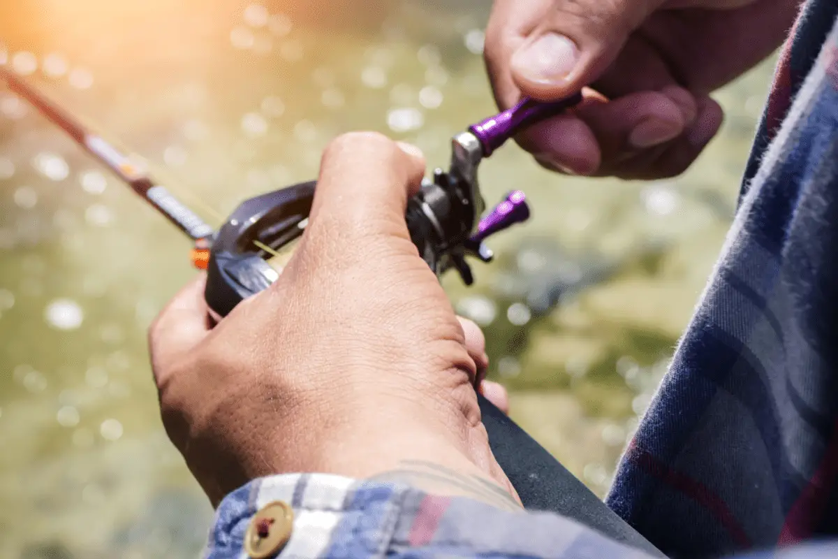 Baitcasting reel in the fisherman hand