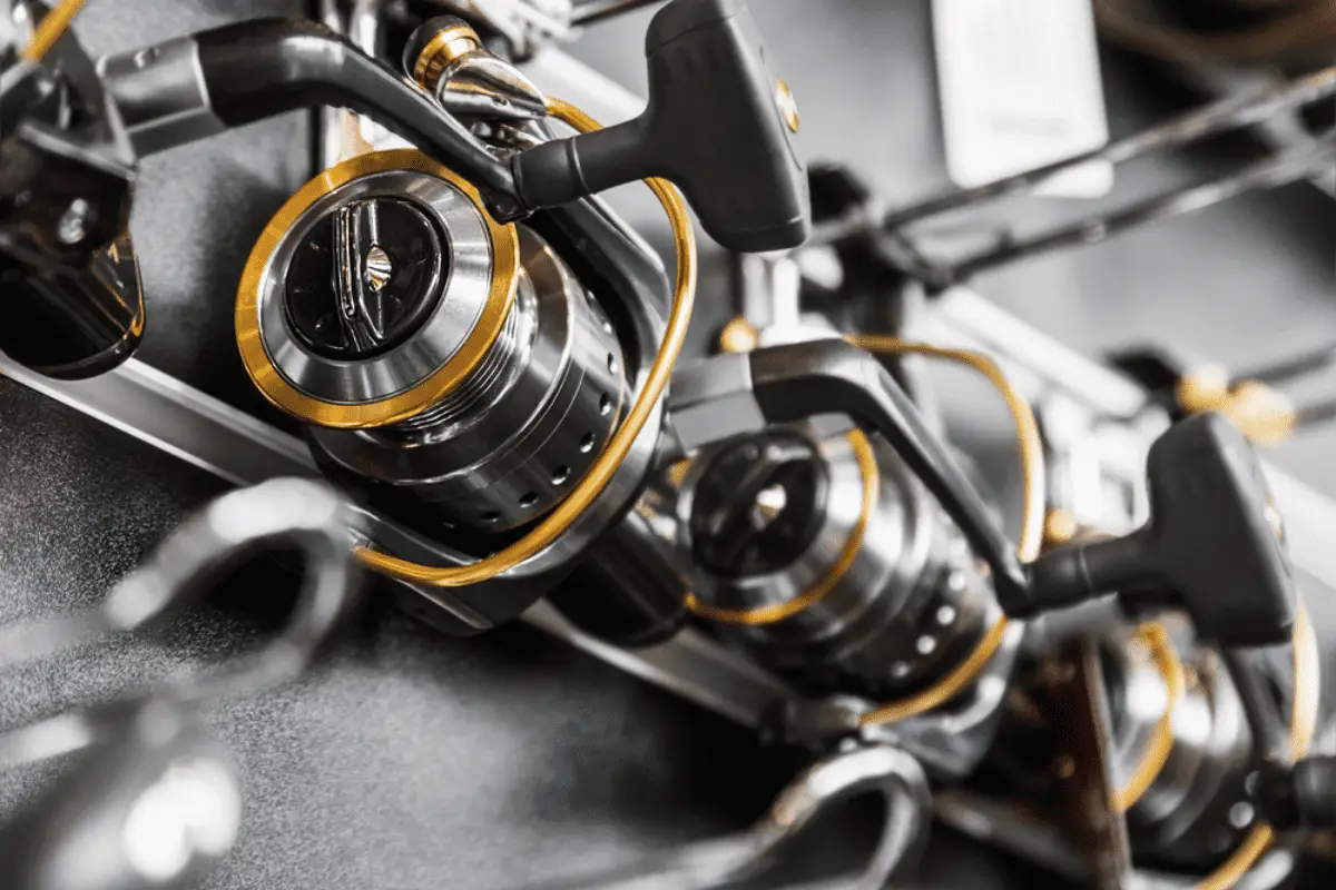 Different fishing reels in the window of a fishing store