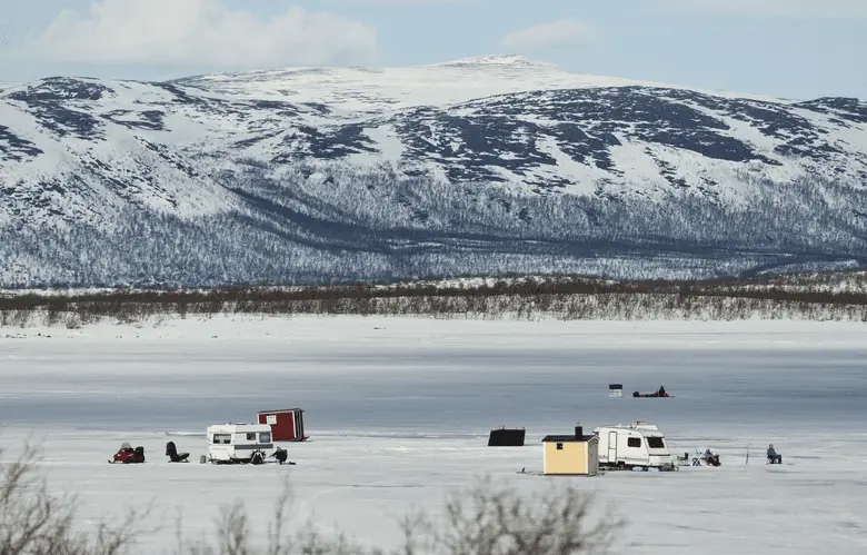 picture of fishermen ice fishing on a lake