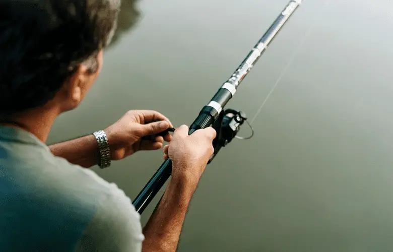 man fishing with a casting rod