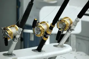 three fishing rods mounted on a fishing boat