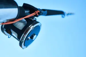 close-up shot of a fishing reel and line